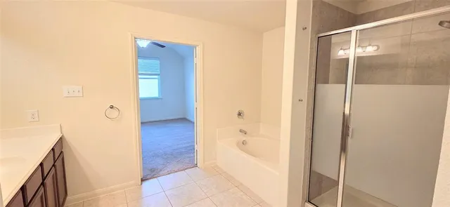 a bathroom with a double vanity sink and mirror