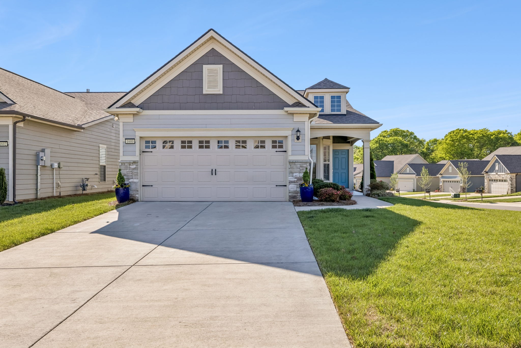 1600 Grainger Springs Spring Hill, TN 37174 - Photo 2 of 26 a view of a house with a yard plants and large tree