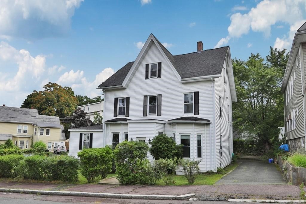 41 Baker Street, Unit 41 Malden, MA 02148 - Photo 2 of 11 a view of white house with a yard and potted plants