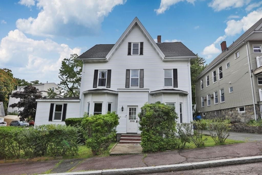 41 Baker Street, Unit 41 Malden, MA 02148 - Photo 5 of 11 a front view of a house with a yard and trees