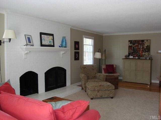 5912 Rondan Circle Raleigh, NC 27612 - Photo 2 of 12 a living room with furniture and a fireplace