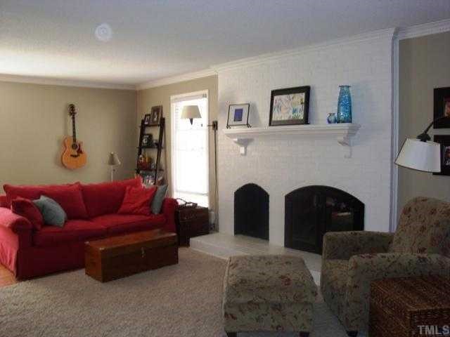 5912 Rondan Circle Raleigh, NC 27612 - Photo 3 of 12 a living room with furniture and a fireplace