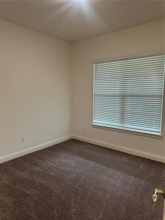 5282 Buttonsage Drive St. Cloud, FL 34772 - Photo 12 of 43 an empty room with a window