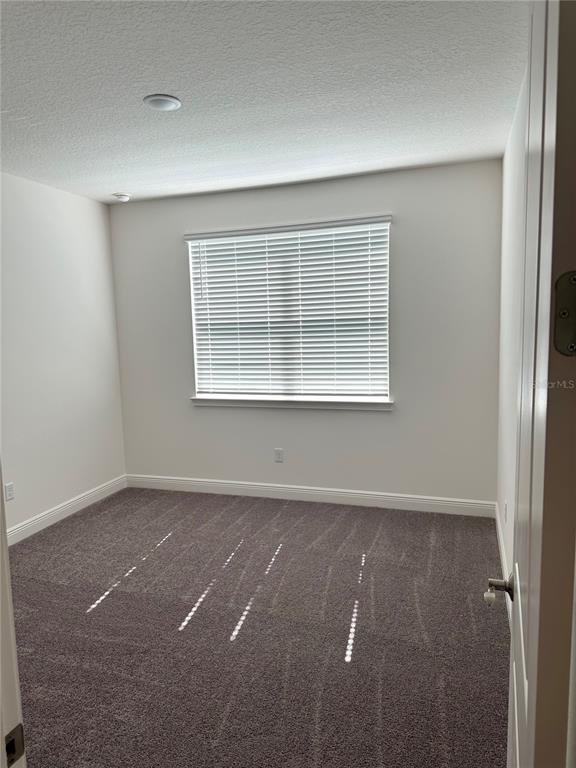 5282 Buttonsage Drive St. Cloud, FL 34772 - Photo 18 of 43 an empty room with a window
