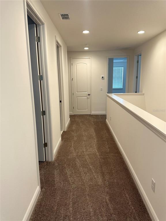 5282 Buttonsage Drive St. Cloud, FL 34772 - Photo 22 of 43 a view of hallway with stairs