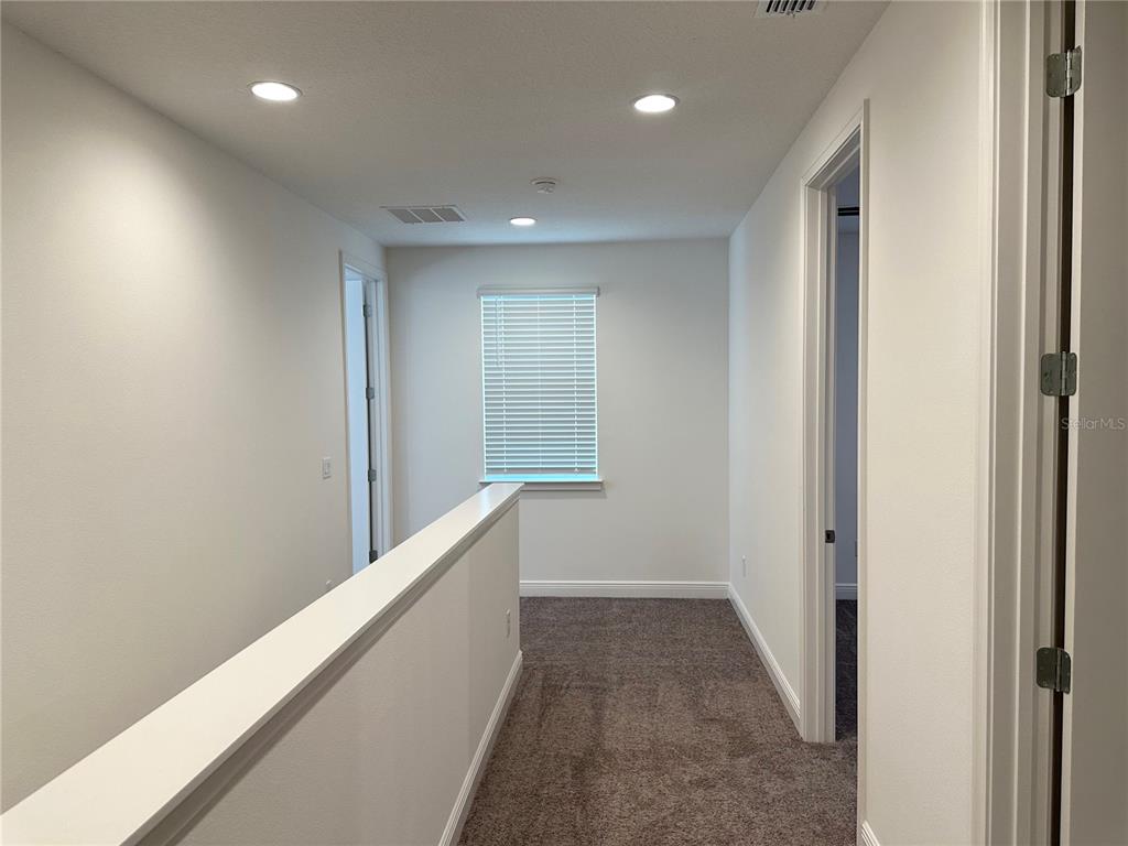 5282 Buttonsage Drive St. Cloud, FL 34772 - Photo 26 of 43 a view of hallway with stairs