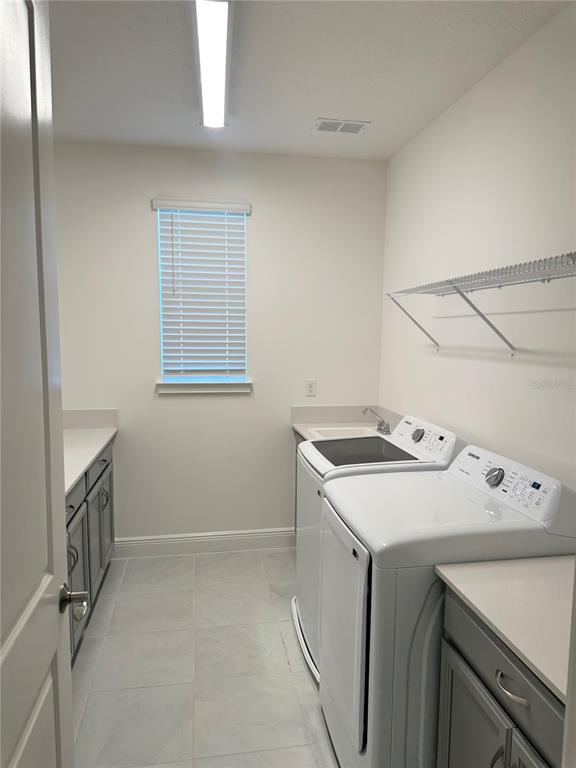 5282 Buttonsage Drive St. Cloud, FL 34772 - Photo 27 of 43 a utility room with dryer and washer
