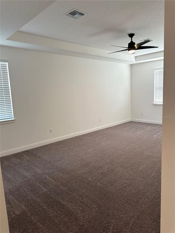 5282 Buttonsage Drive St. Cloud, FL 34772 - Photo 30 of 43 an empty room with a ceiling fan and window