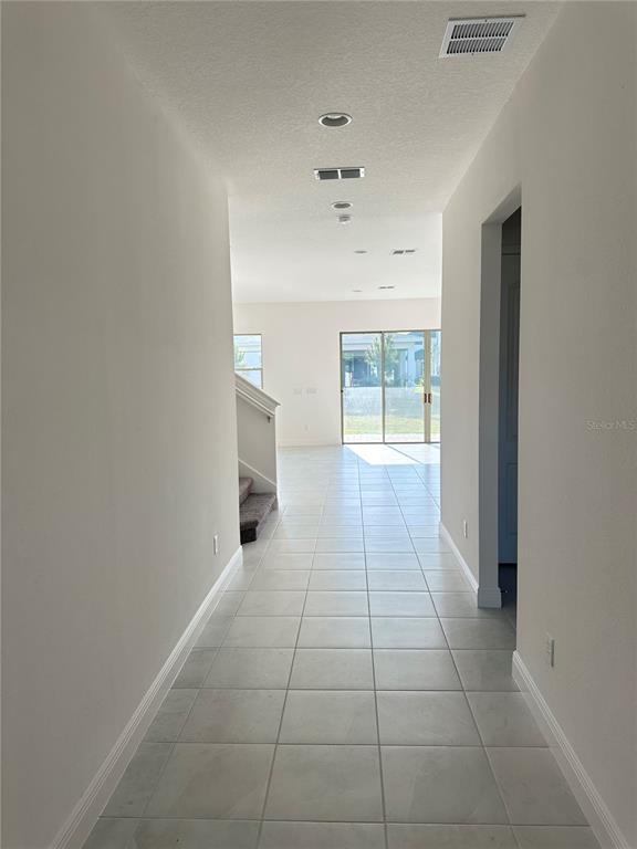 5282 Buttonsage Drive St. Cloud, FL 34772 - Photo 6 of 43 a view of an empty room with a window