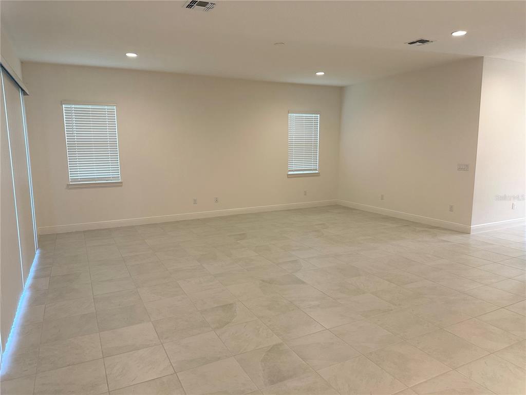 5282 Buttonsage Drive St. Cloud, FL 34772 - Photo 8 of 43 an empty room with windows