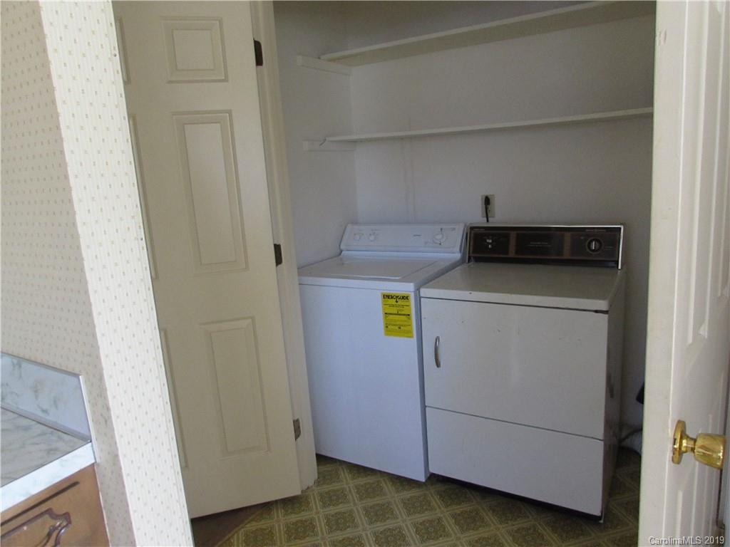 6012 Pleasant Grove Road Charlotte, NC 28216 - Photo 7 of 13 a utility room with dryer and washer