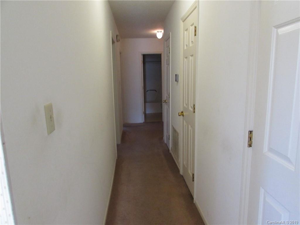 6012 Pleasant Grove Road Charlotte, NC 28216 - Photo 8 of 13 a view of a hallway with a hallway