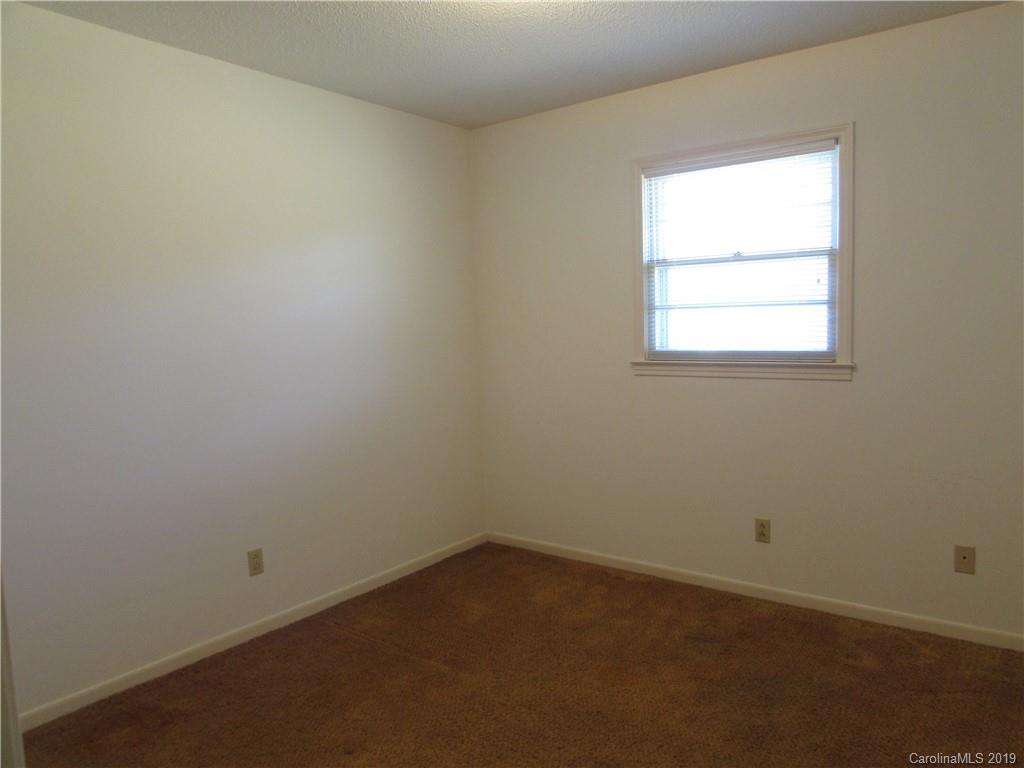 6012 Pleasant Grove Road Charlotte, NC 28216 - Photo 9 of 13 an empty room with a window