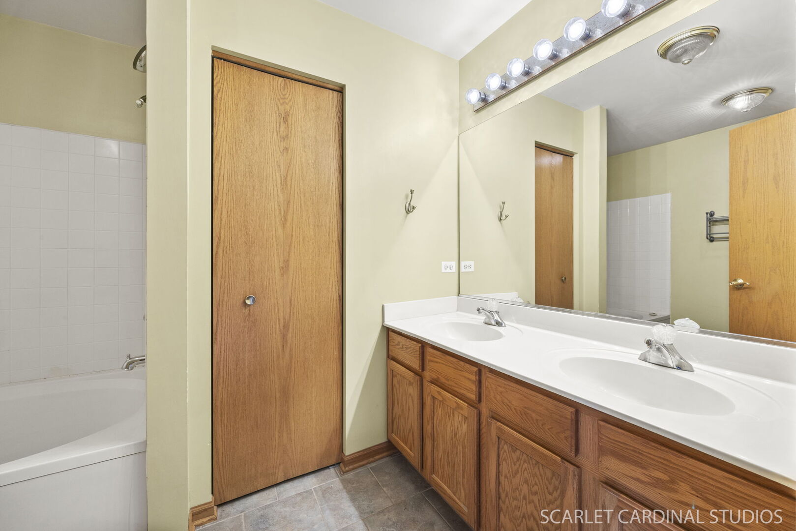 2242 Foxmoor Lane, Unit 2242 Aurora, IL 60502 - Photo 14 of 20 a bathroom with a double vanity sink a toilet and a mirror