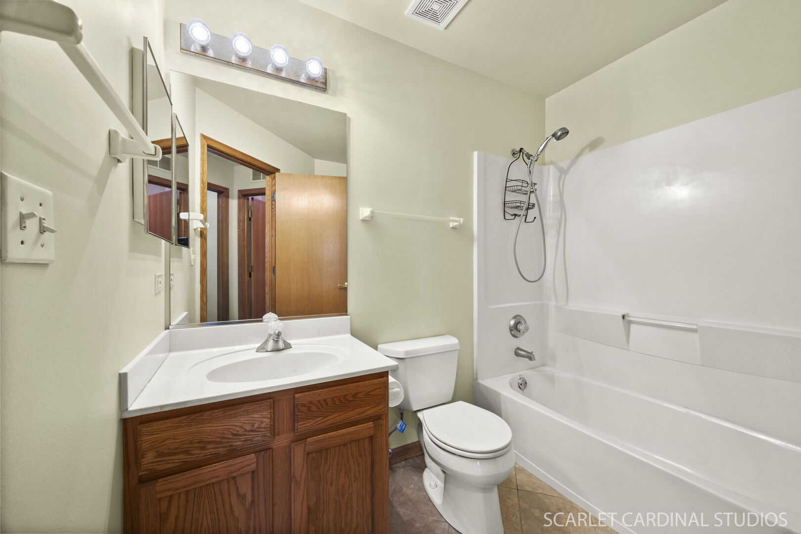 2242 Foxmoor Lane, Unit 2242 Aurora, IL 60502 - Photo 18 of 20 a bathroom with a bathtub shower sink mirror vanity and toilet