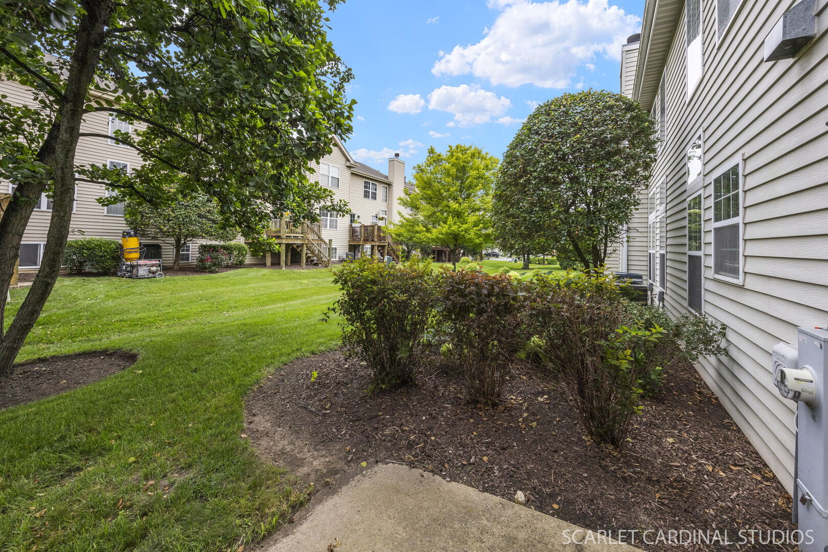 2242 Foxmoor Lane, Unit 2242 Aurora, IL 60502 - Photo 19 of 20 a view of a garden with large trees