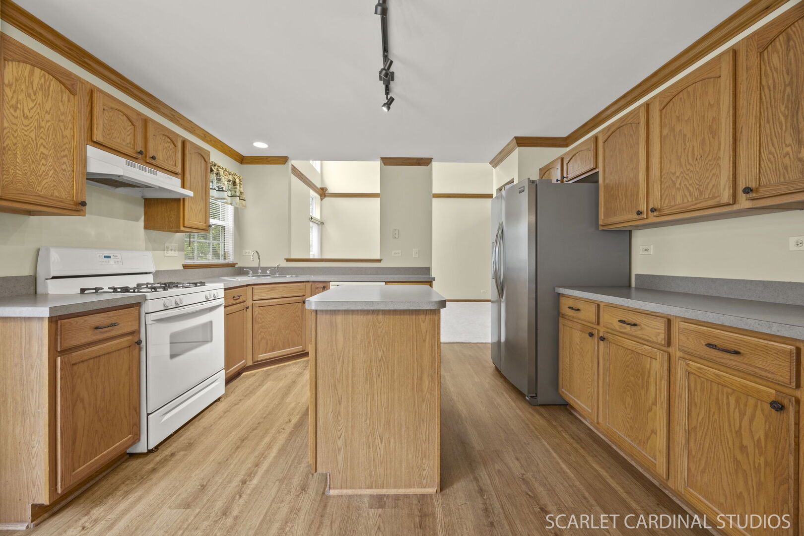 2242 Foxmoor Lane, Unit 2242 Aurora, IL 60502 - Photo 6 of 20 a kitchen with white cabinets and white appliances