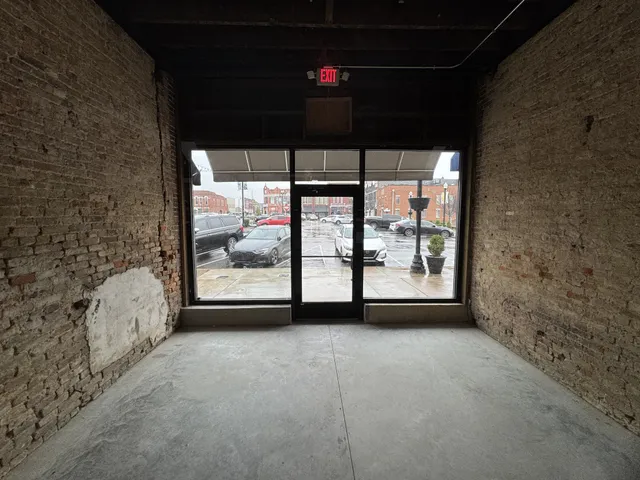 a view of an empty room with windows