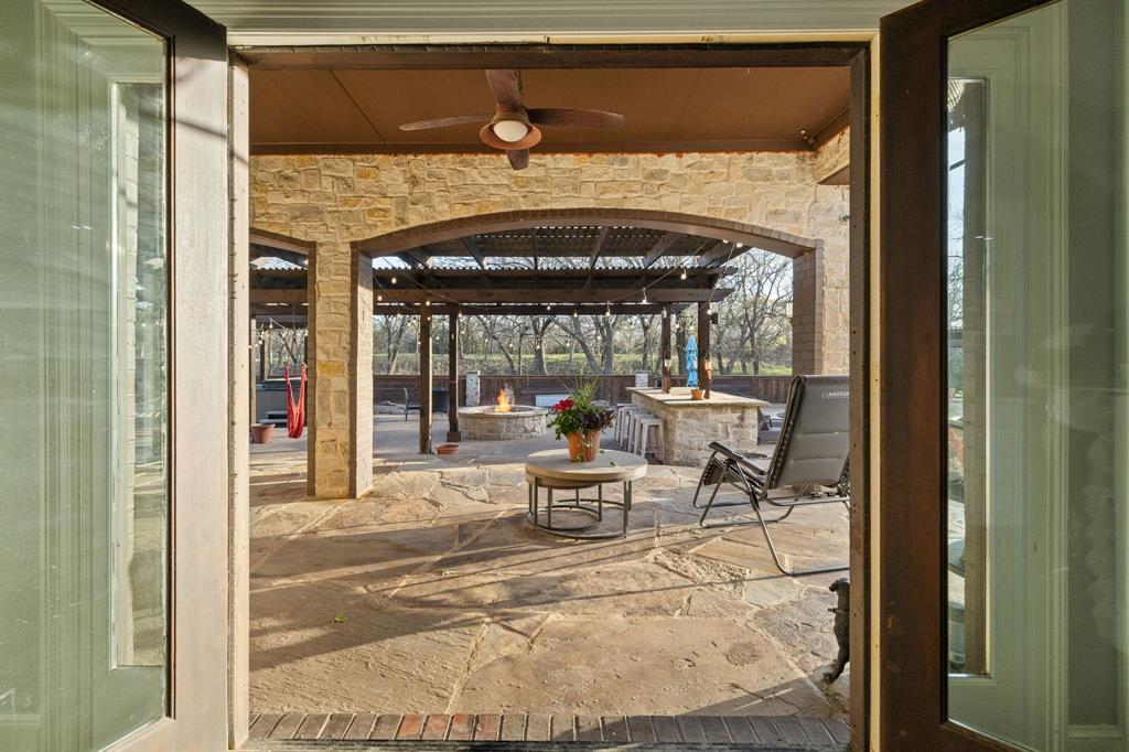 689 Jim Cannon Road Van Alstyne, TX 75495 - Photo 8 of 35 View of patio / terrace with a ceiling fan, a pergola, and an outdoor fire pit