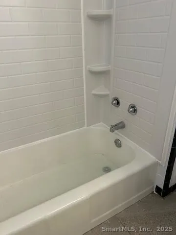 a bathroom with a bathtub