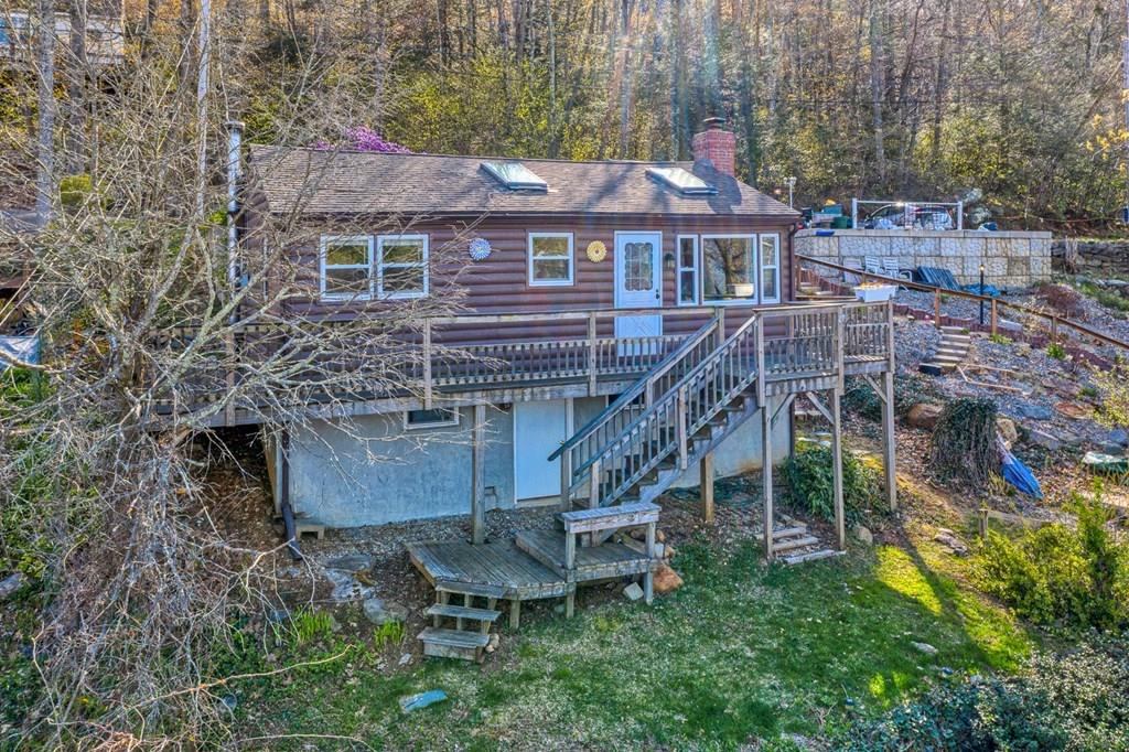 28 Stony Hill Road Holland, MA 01521 - Photo 23 of 27 a aerial view of a house with a yard table and chairs