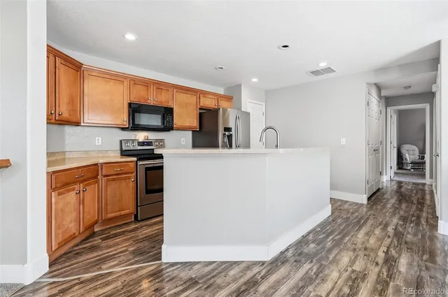 $295,000 | 11855 Oak Hill Way, Unit A, Commerce City, CO 80640