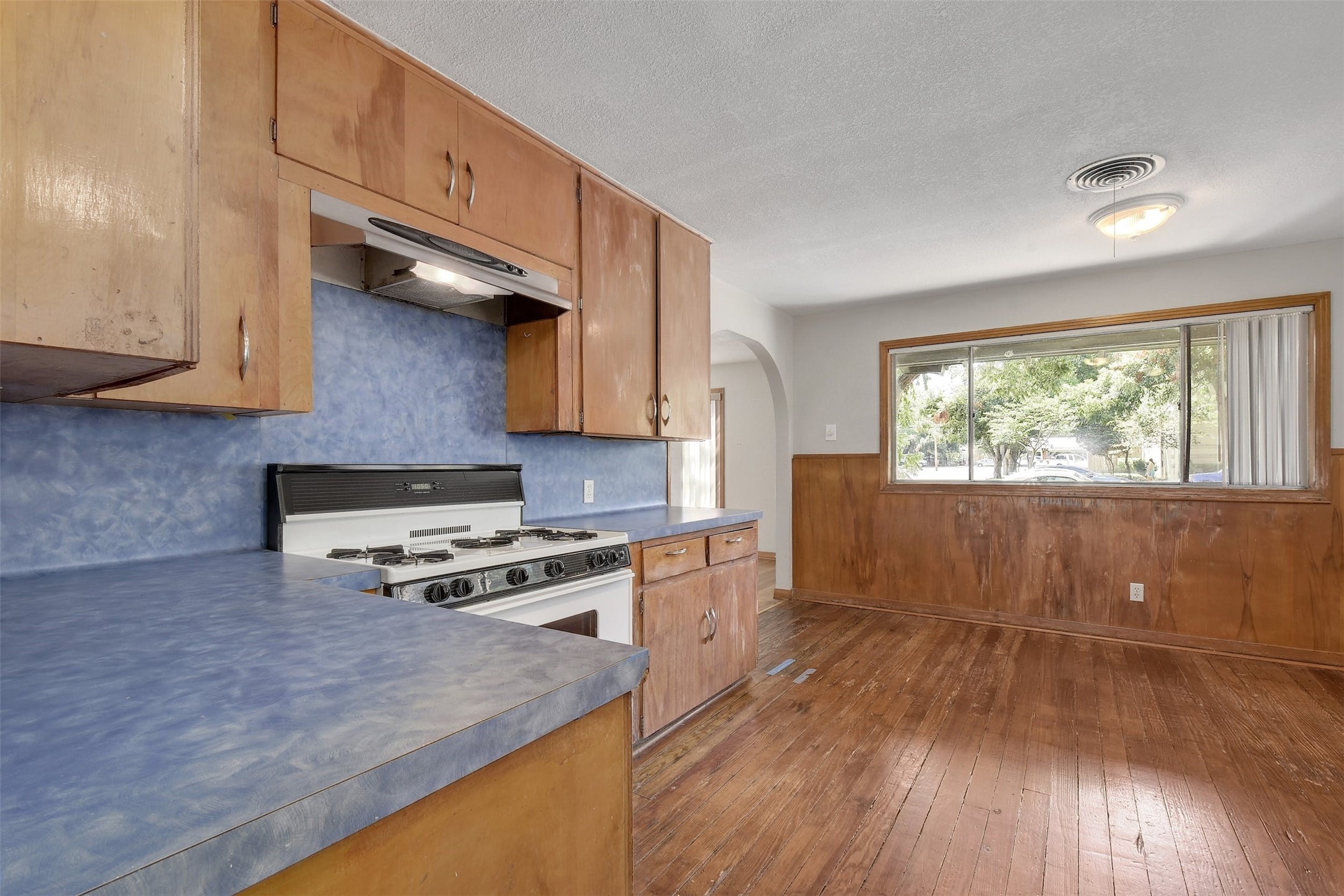 4306 Avenue B Austin, TX 78751 - Photo 11 of 34 a kitchen with wooden floors and a stove