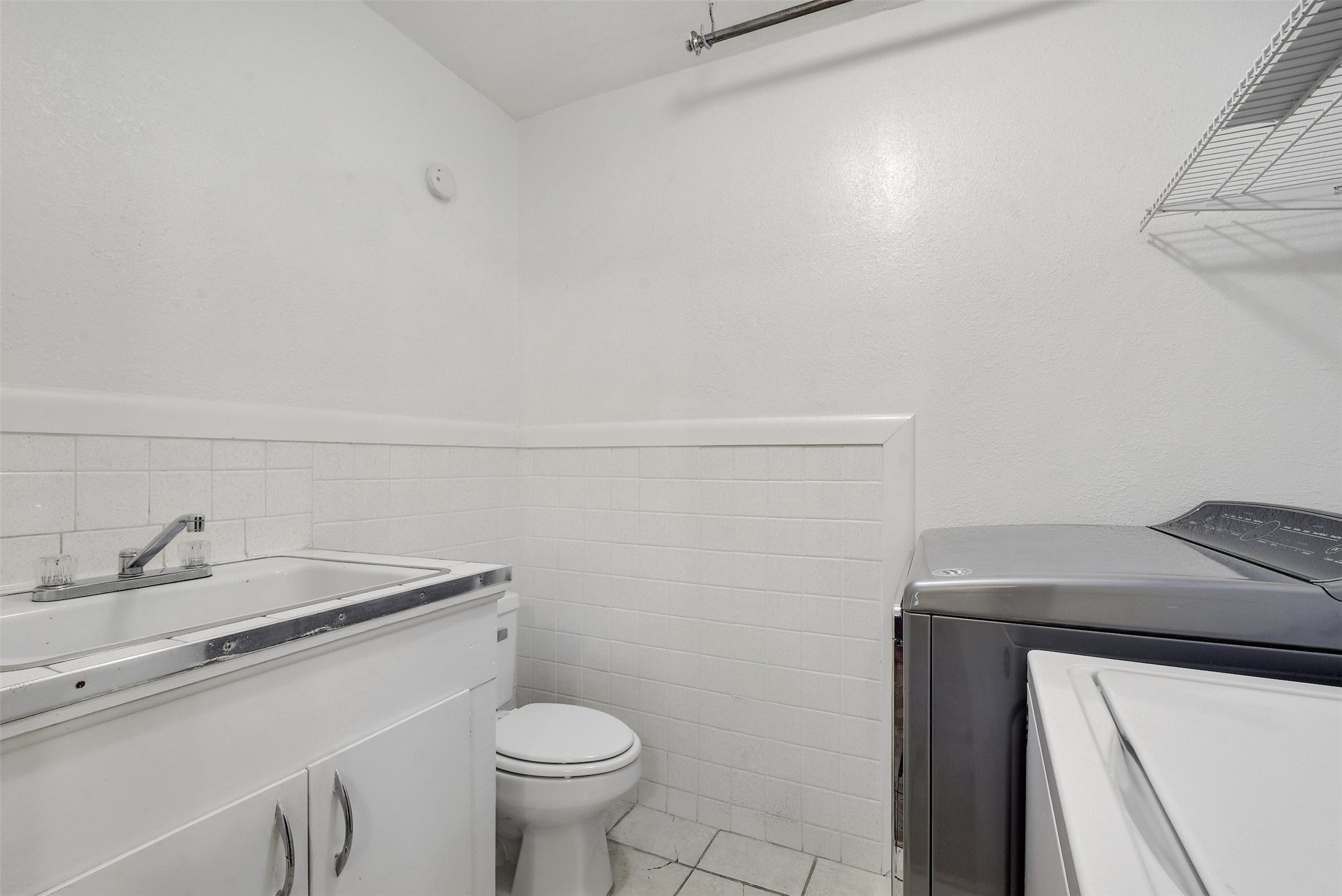 4306 Avenue B Austin, TX 78751 - Photo 14 of 34 a bathroom with a sink toilet and vanity