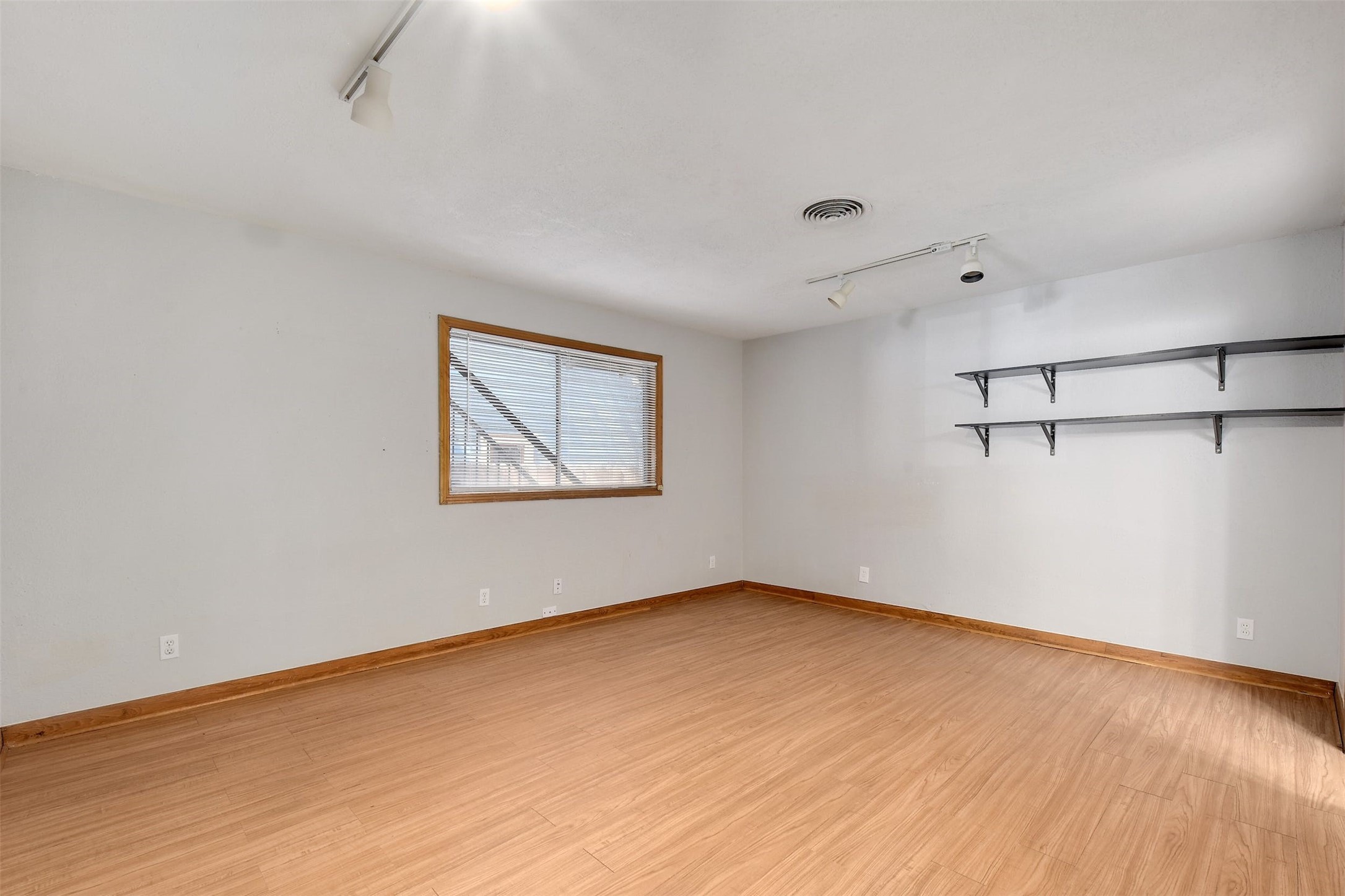 4306 Avenue B Austin, TX 78751 - Photo 15 of 34 a view of a room with wooden floor