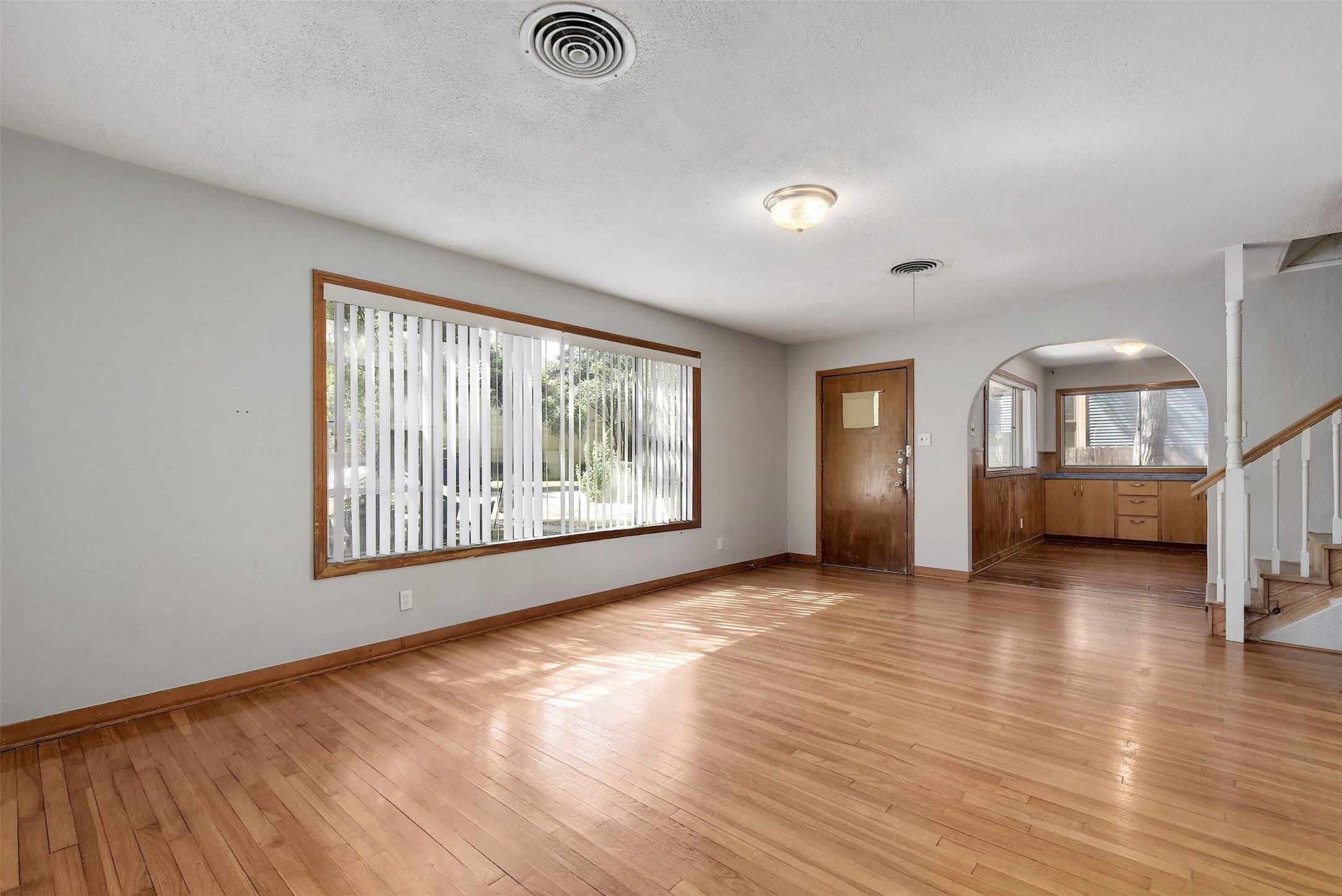 4306 Avenue B Austin, TX 78751 - Photo 2 of 34 an empty room with wooden floor and windows