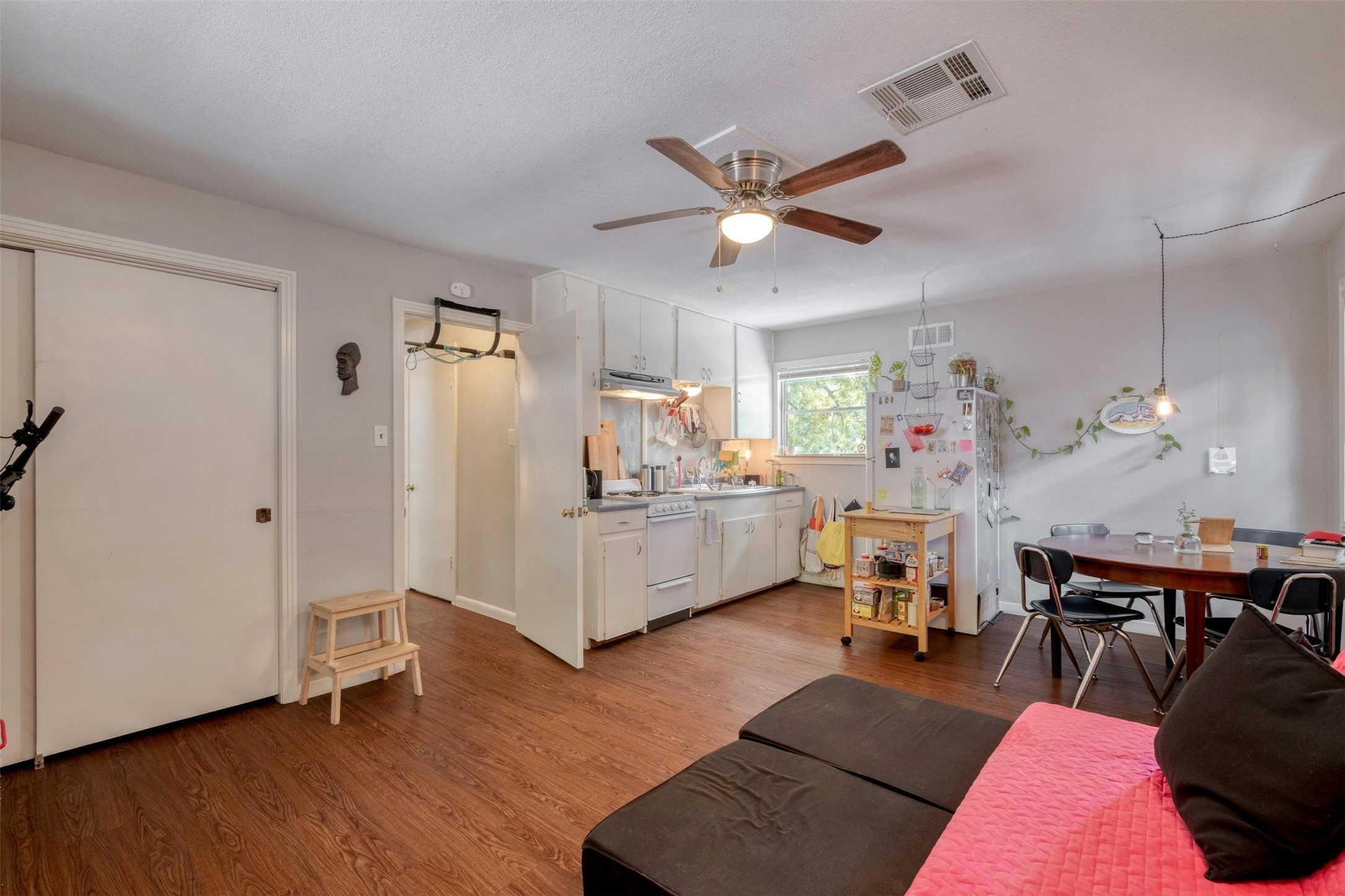 4306 Avenue B Austin, TX 78751 - Photo 27 of 34 a living room with furniture and a wooden floor