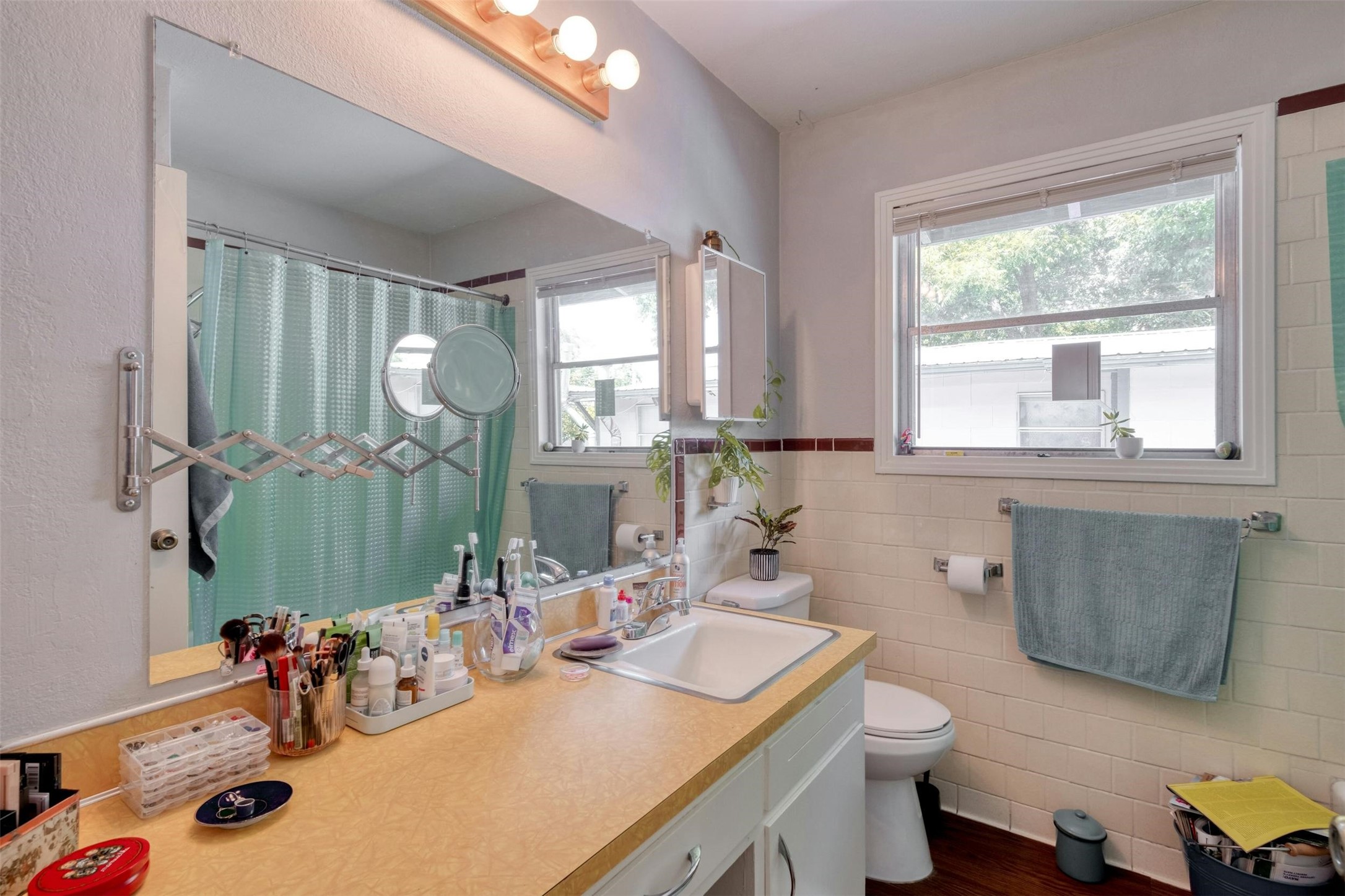 4306 Avenue B Austin, TX 78751 - Photo 32 of 34 a bathroom with a sink double vanity and a mirror