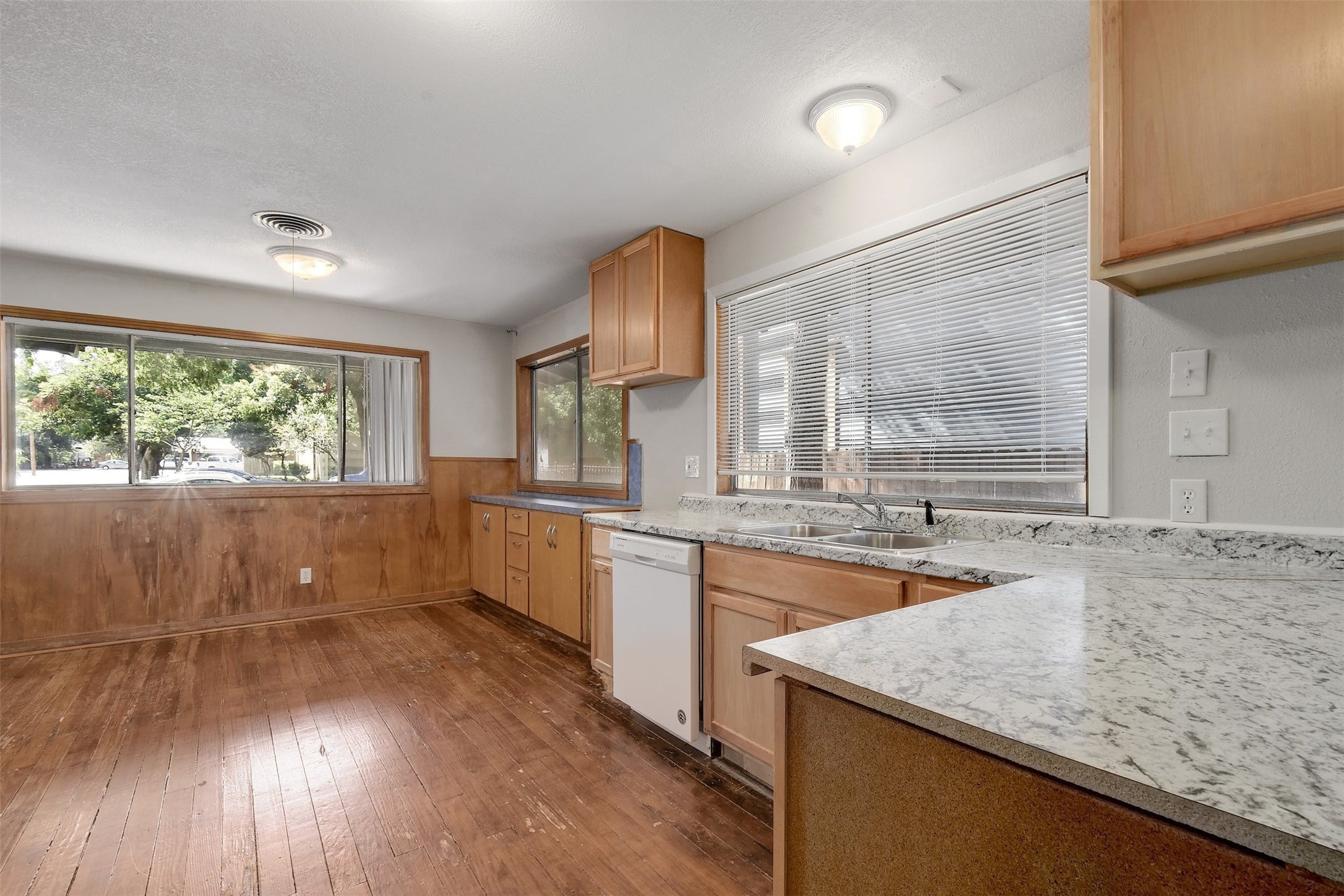 4306 Avenue B Austin, TX 78751 - Photo 9 of 34 a kitchen with sink cabinets and wooden floor