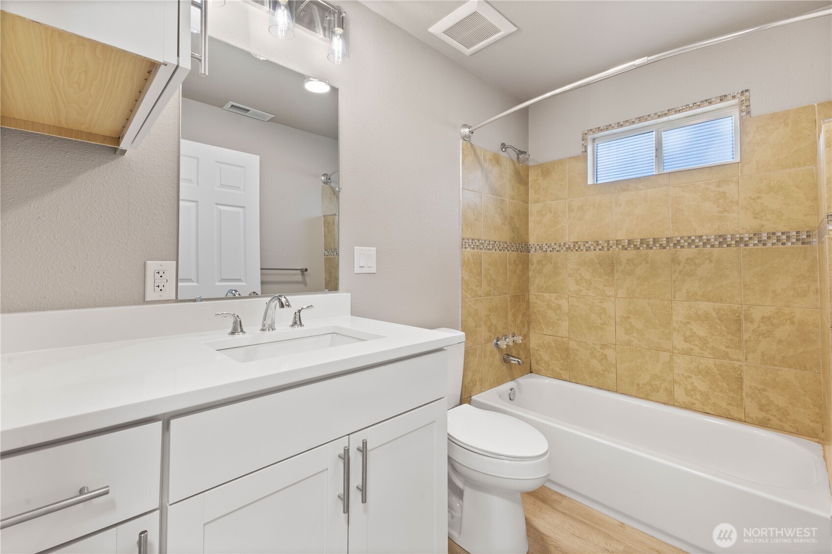 639 Elizabeth Street Sumner, WA 98390 - Photo 18 of 26 a bathroom with a sink a toilet and shower