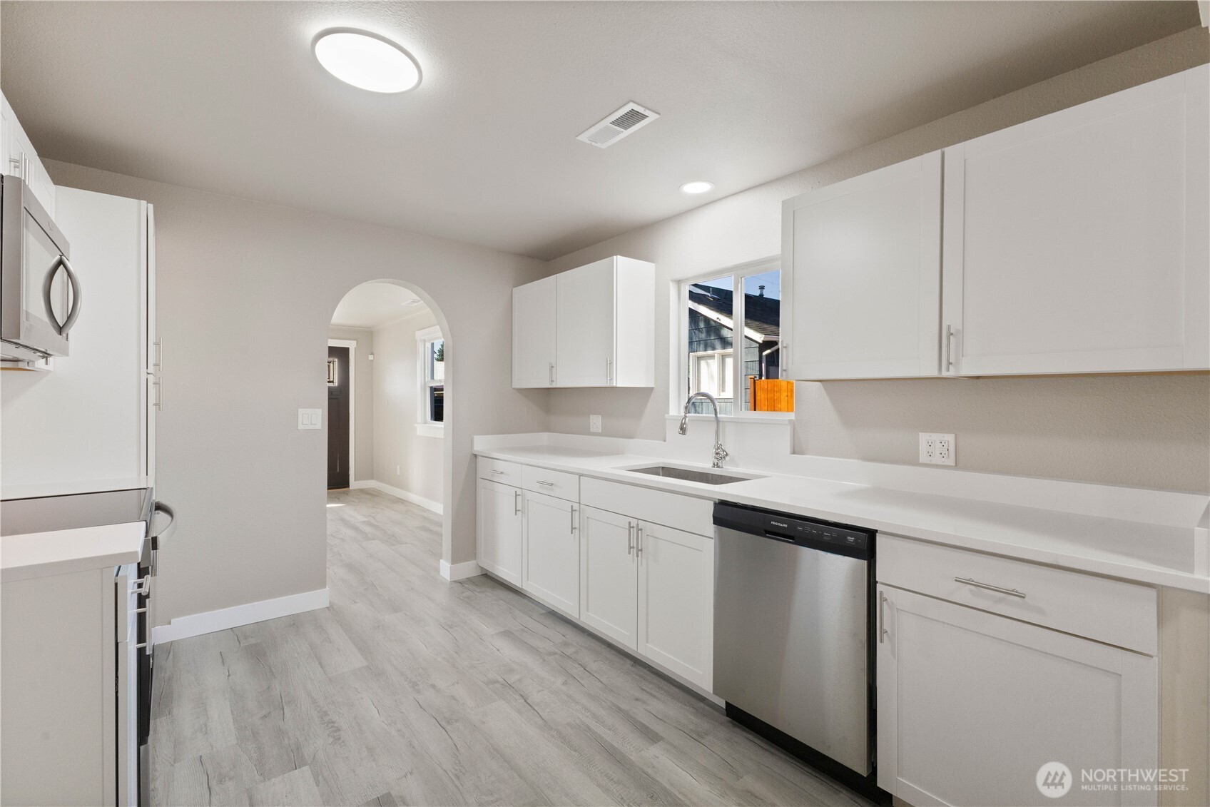 639 Elizabeth Street Sumner, WA 98390 - Photo 8 of 26 a kitchen with a sink cabinets and window