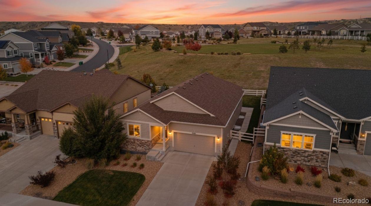 an aerial view of a house with a lake view