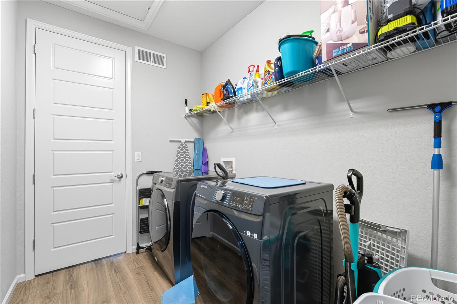 5740 Berry Ridge Wy. Castle Rock, CO 80104 - Photo 16 of 38 a view of storage and utility room with washer and dryer