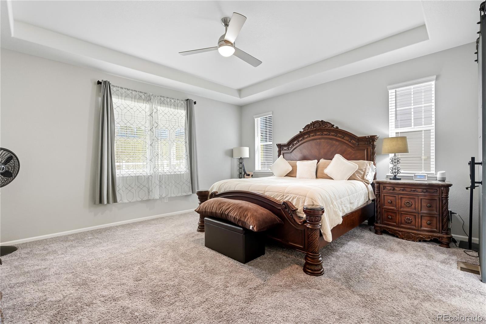 5740 Berry Ridge Wy. Castle Rock, CO 80104 - Photo 17 of 38 a spacious bedroom with a bed and a window