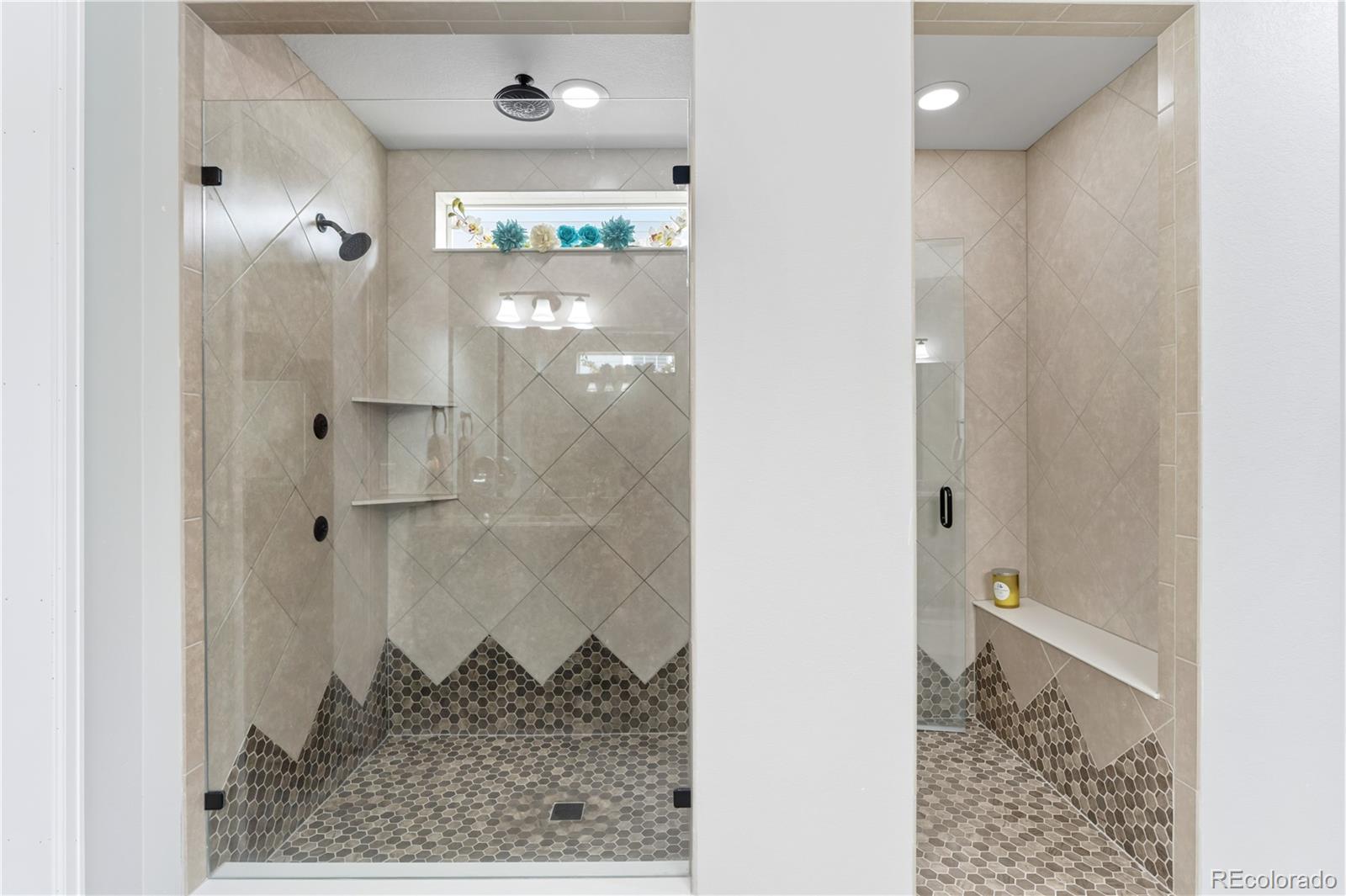 5740 Berry Ridge Wy. Castle Rock, CO 80104 - Photo 22 of 38 a bathroom with a granite countertop shower and a sink
