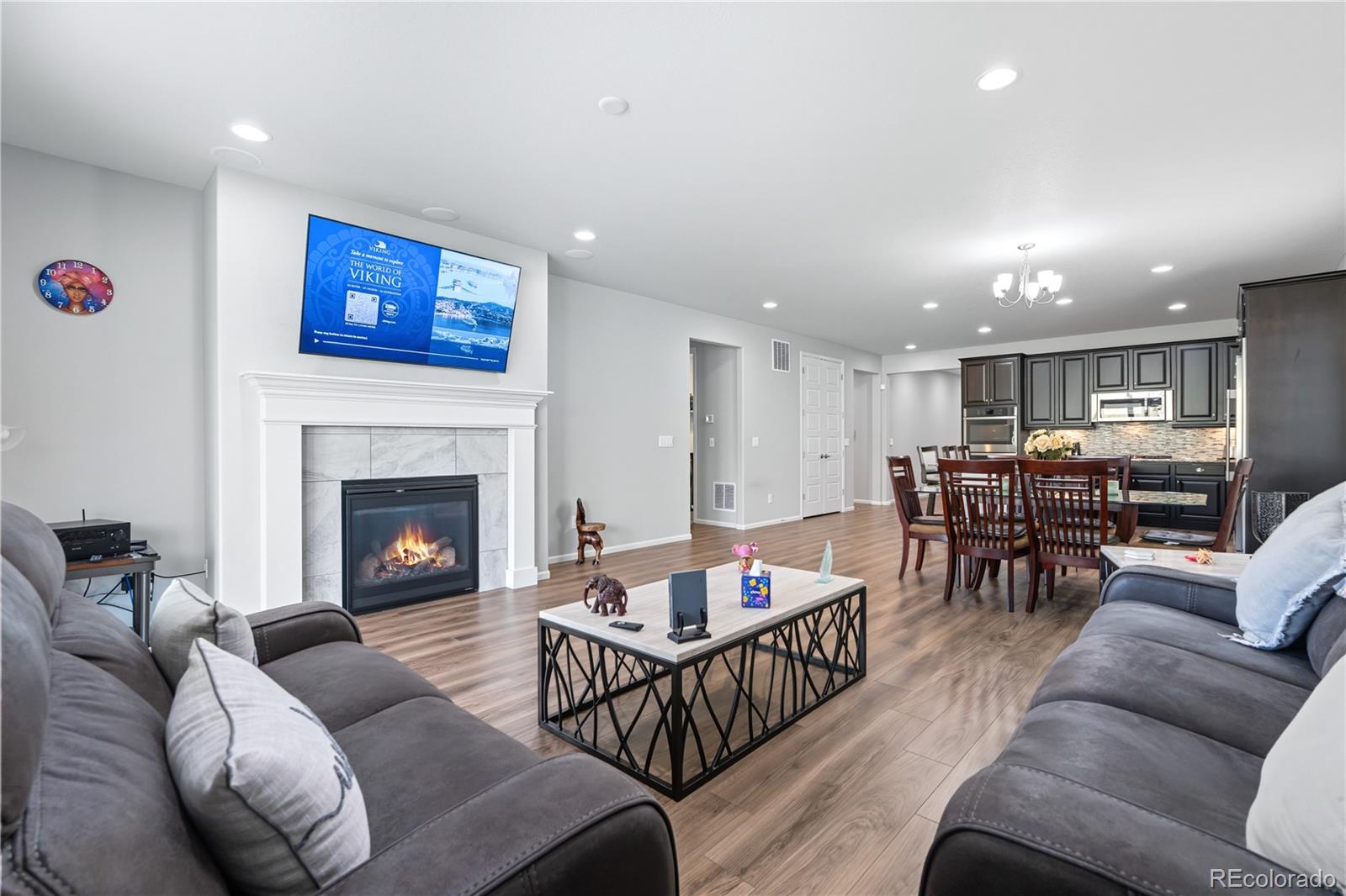 5740 Berry Ridge Wy. Castle Rock, CO 80104 - Photo 3 of 38 a living room with furniture and a fireplace