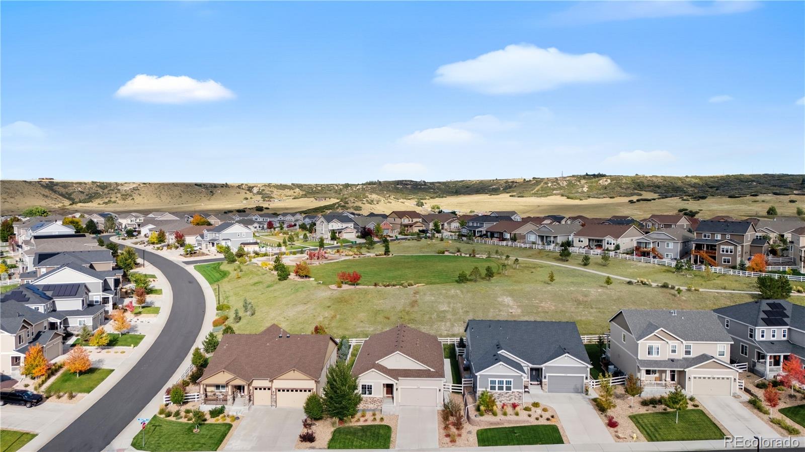 5740 Berry Ridge Wy. Castle Rock, CO 80104 - Photo 36 of 38 an aerial view of residential building and lake