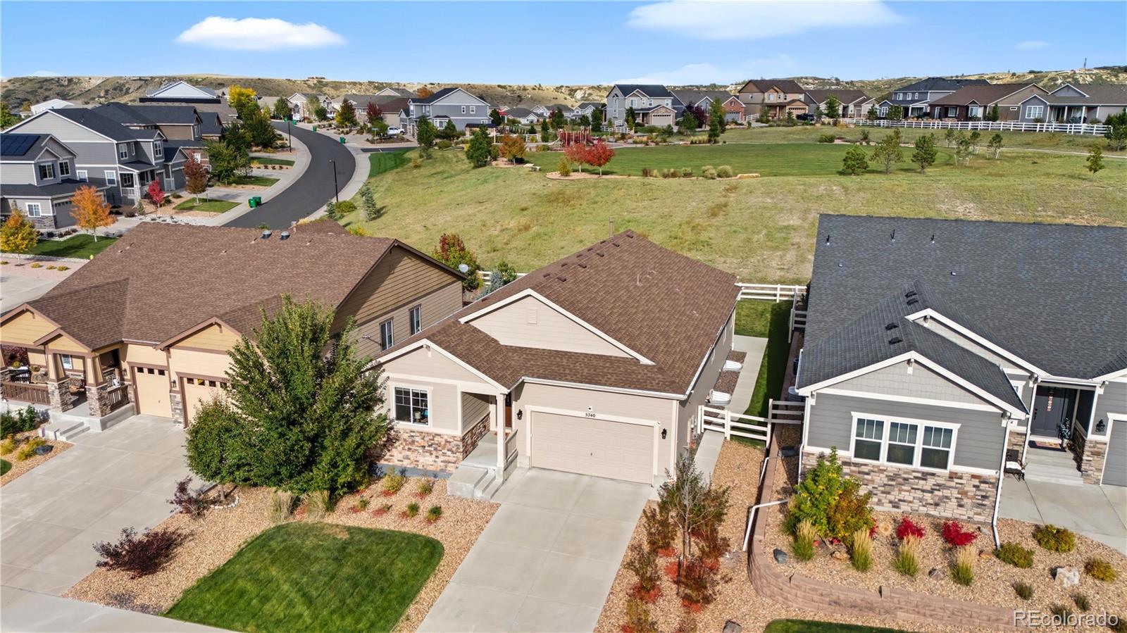 5740 Berry Ridge Wy. Castle Rock, CO 80104 - Photo 38 of 38 an aerial view of a house with a yard and lake view