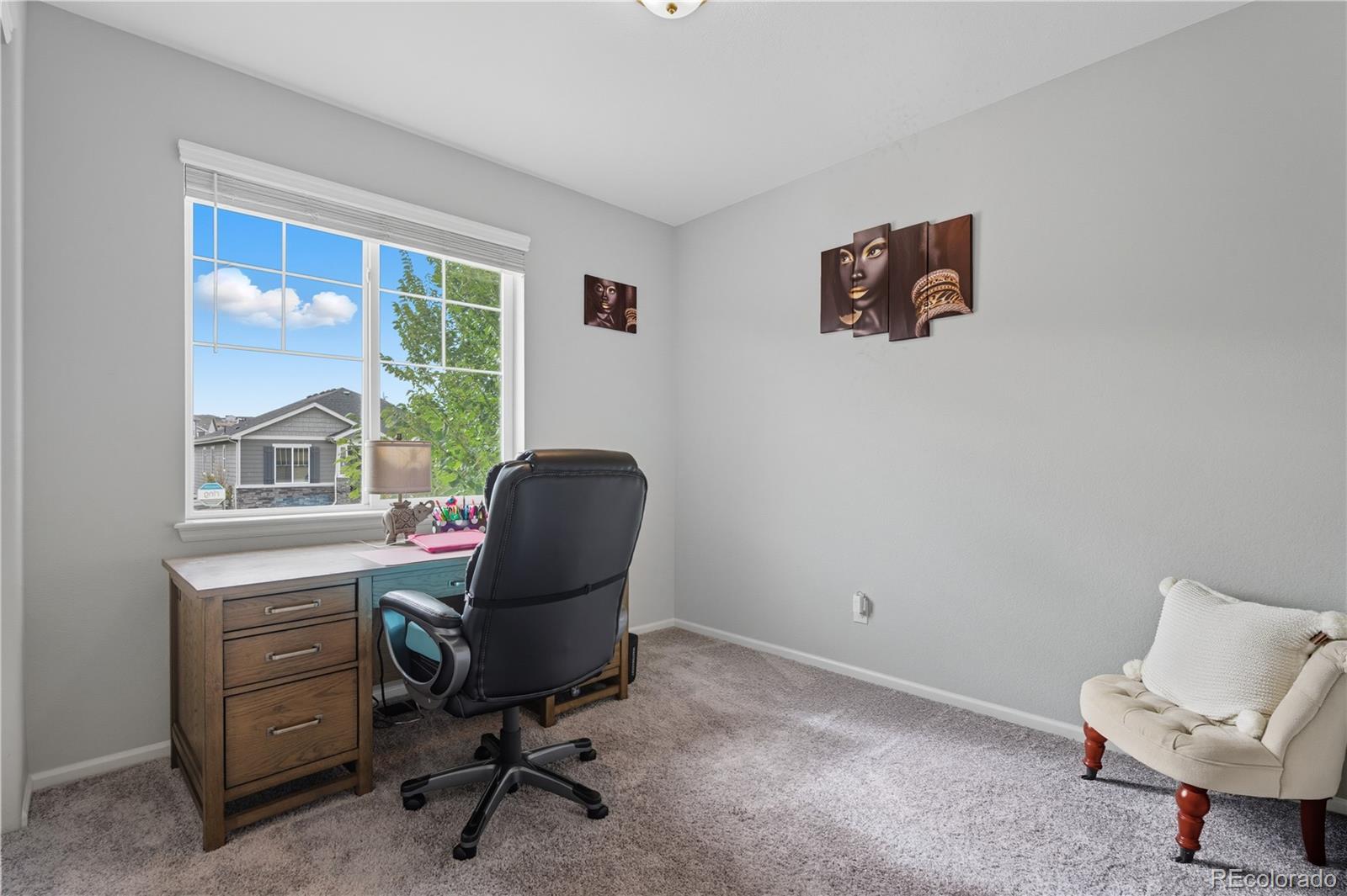 5740 Berry Ridge Wy. Castle Rock, CO 80104 - Photo 5 of 38 a view of a workspace with furniture and a window