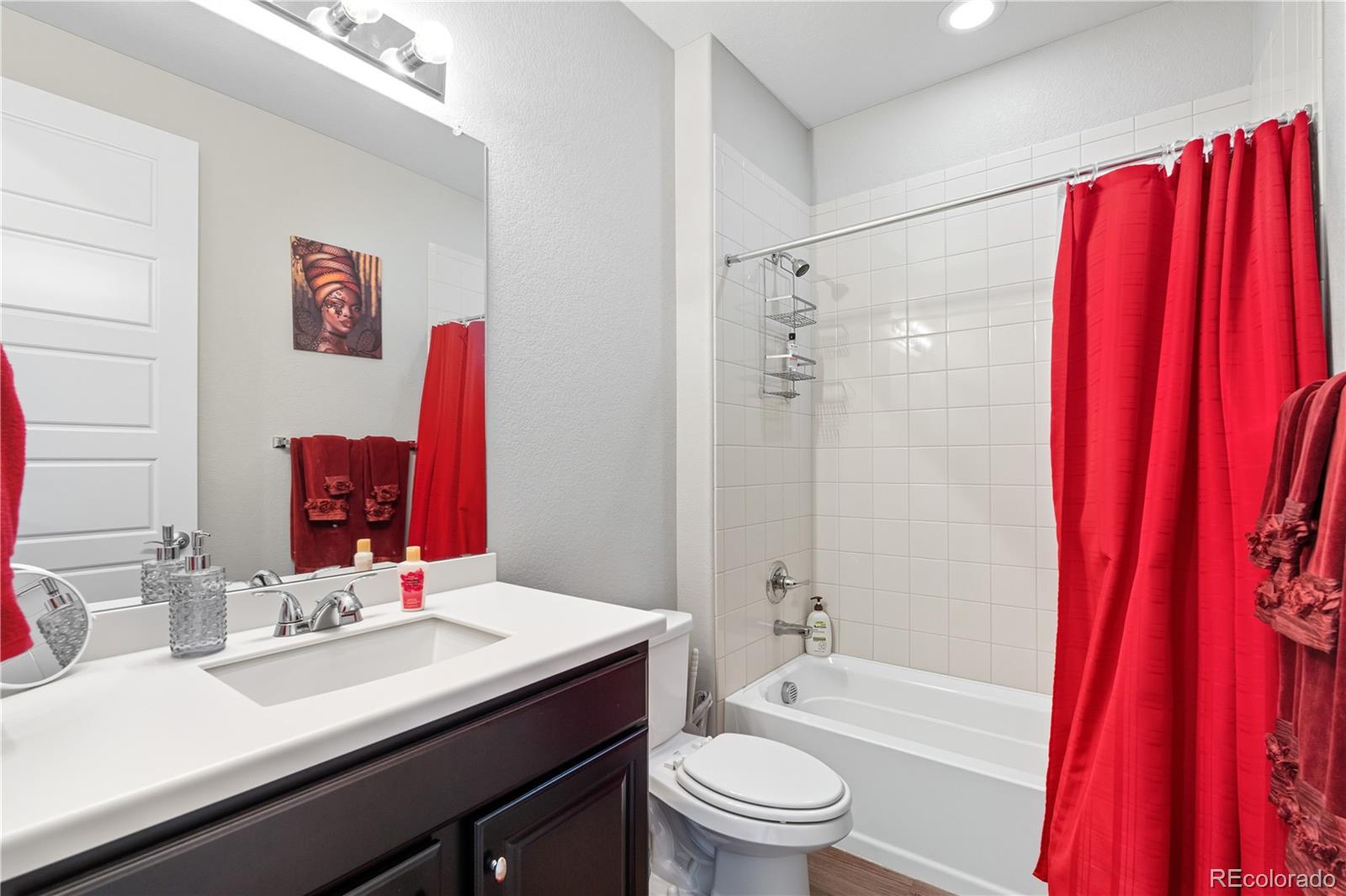 5740 Berry Ridge Wy. Castle Rock, CO 80104 - Photo 7 of 38 a bathroom with a sink a toilet a tub and shower