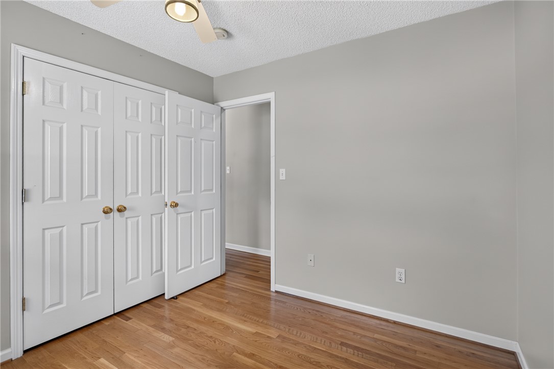 113 Greenfield Avenue Pendleton, SC 29670 - Photo 22 of 40 Hardwood floors and a spacious closet create a highly functional bedroom space.