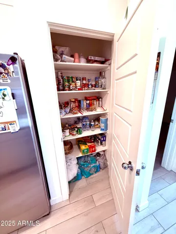 a view of a hallway with shelf