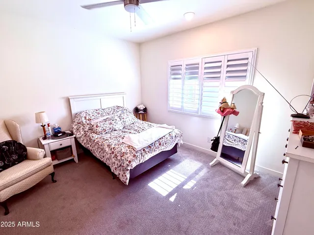 a bedroom with a bed and a couch