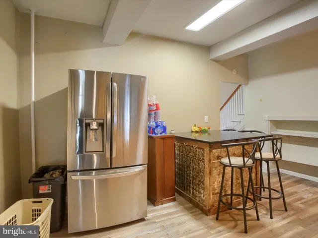a kitchen with stainless steel appliances granite countertop a stove and cabinets