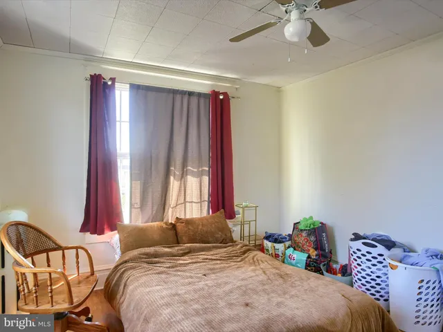 a bathroom with a toilet a sink and window