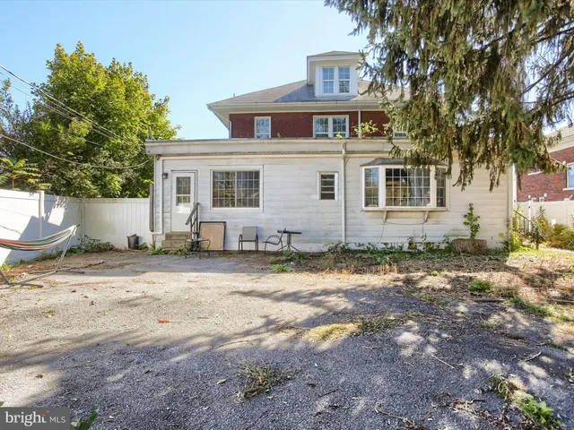 a view of a backyard of the house